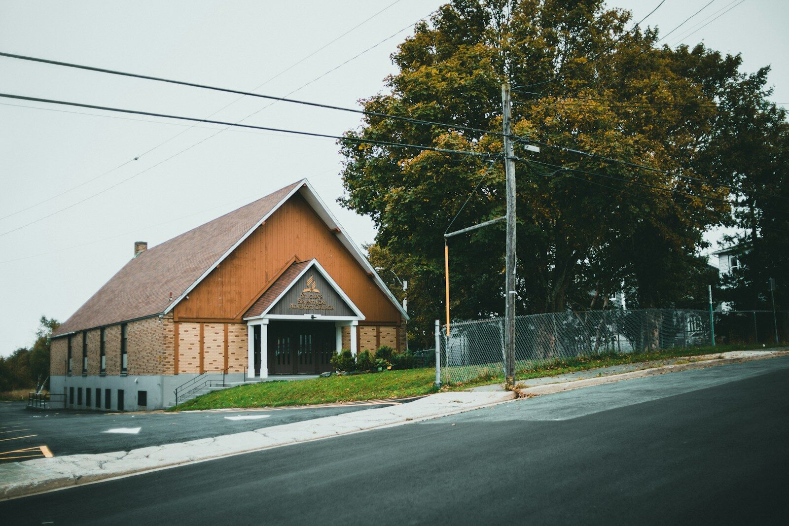 a small church sits on the corner of a street